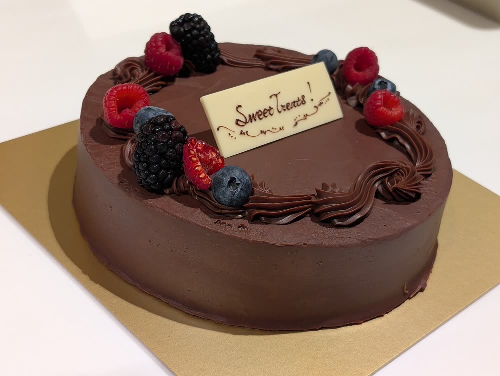 Chocolate cake topped with berries