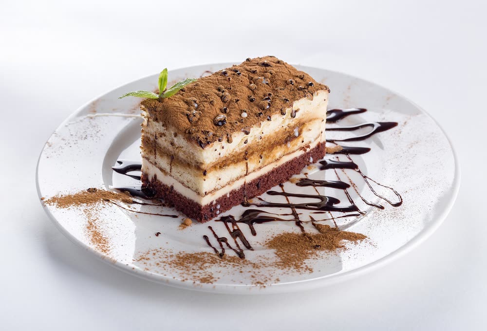 Layered cake slice with cocoa